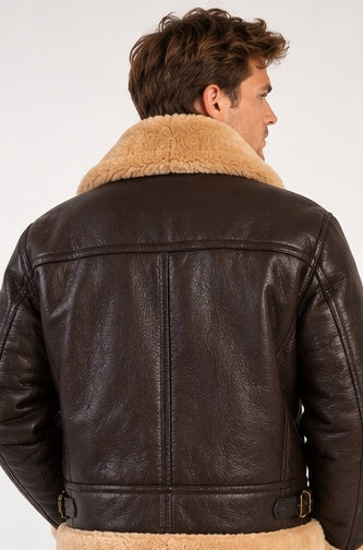 A man wearing a dark brown leather aviator jacket with a thick beige shearling collar, shown from the back against a plain white background.