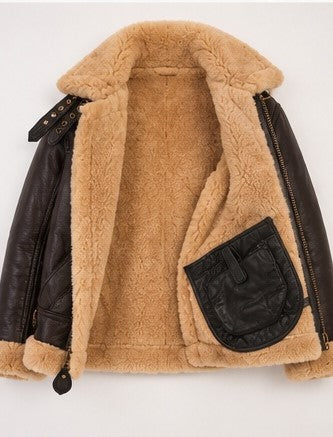 A shearling-lined aviator-style jacket with dark brown faux leather sleeves and collar trim, featuring a tan shearling lining, a black chest pocket, and zipper details, shown against a plain white background.